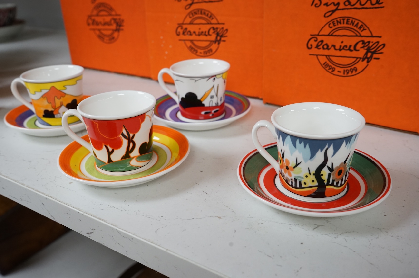 Four boxed limited edition Clarice Cliff cups and saucers to include Fantasque Mountain and Red Autumn, saucers 11.5cm in diameter